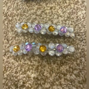 Set of 2 Homemade barrettes! 3inch with gold, silver and purple gems.